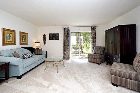 a living room with a couch and two chairs